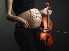 Pregnant woman with violin