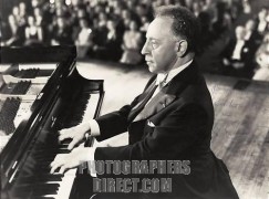 Arthur Rubinstein playing Steinway piano keyboard in front of audience in 1947 film 'Carnegie Hall'