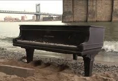 A concert grand is washed up on Manhattan’s shore