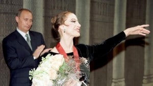 File photo of Vladimir Putin clapping for prima ballerina Maya Plisetskaya at the Bolshoi Theatre in Moscow