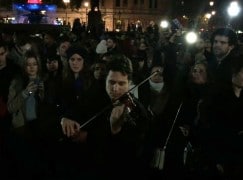 A violinist plays for France in Trafalgar Square