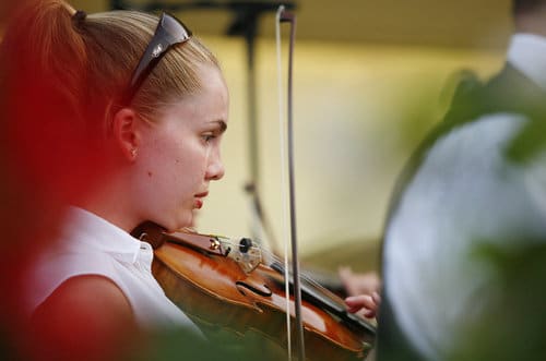 Sarah Maley plays the violin with the Middletown Symphony Orchestra during the Labor Day Pops Concert Monday, September 1, 2008 at Woodside Arboretum in Middletown, Ohio.  Staff photo by Nick Graham