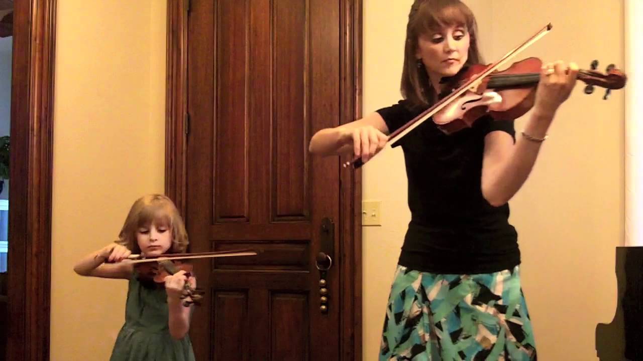 Mother and child play Bach’s double concerto