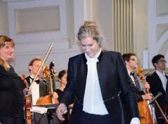 A woman conductor changes orchestras ‘one note at a time’