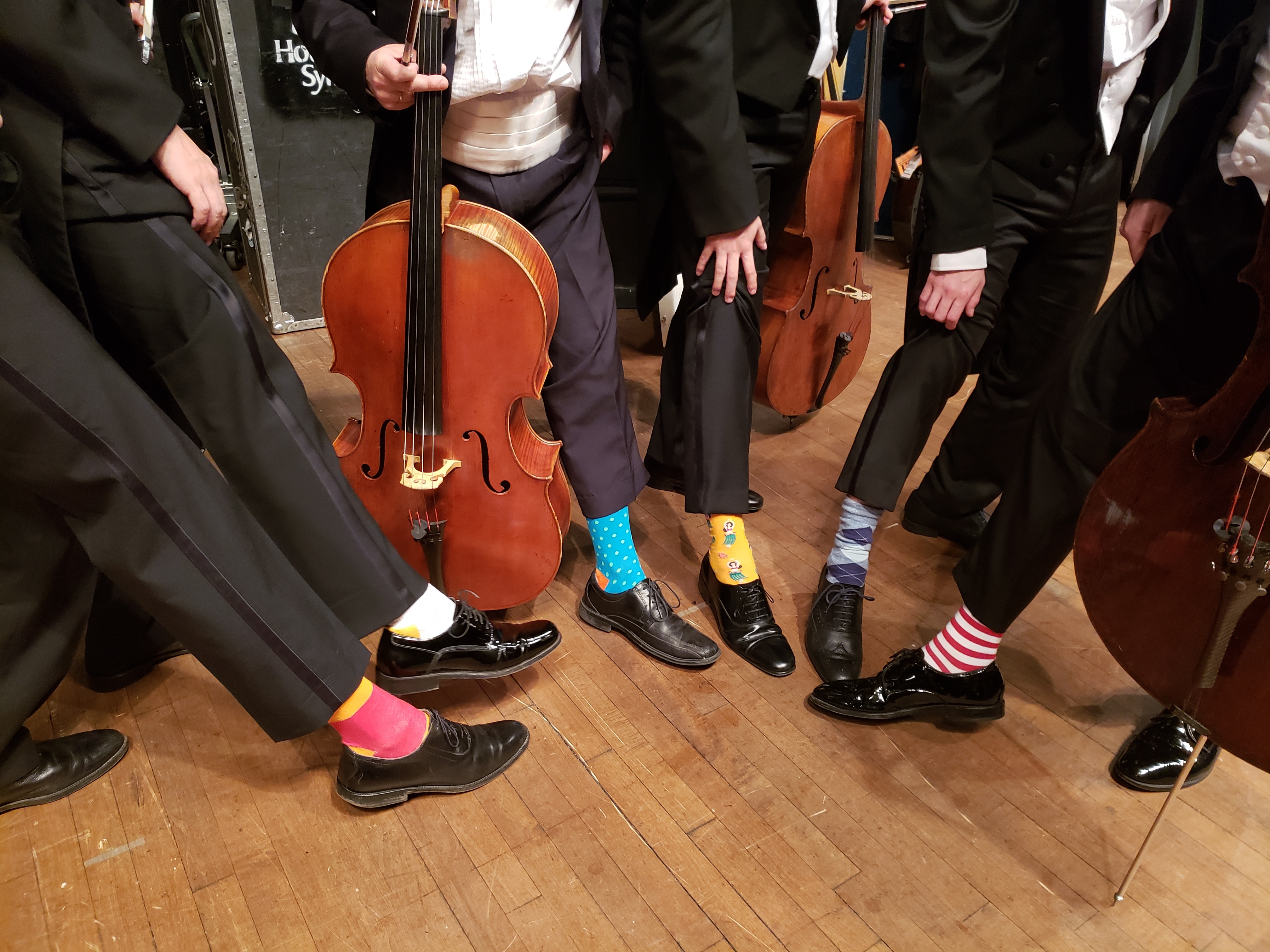 Symphony orchestra wears cheeky socks in honour of late President Bush