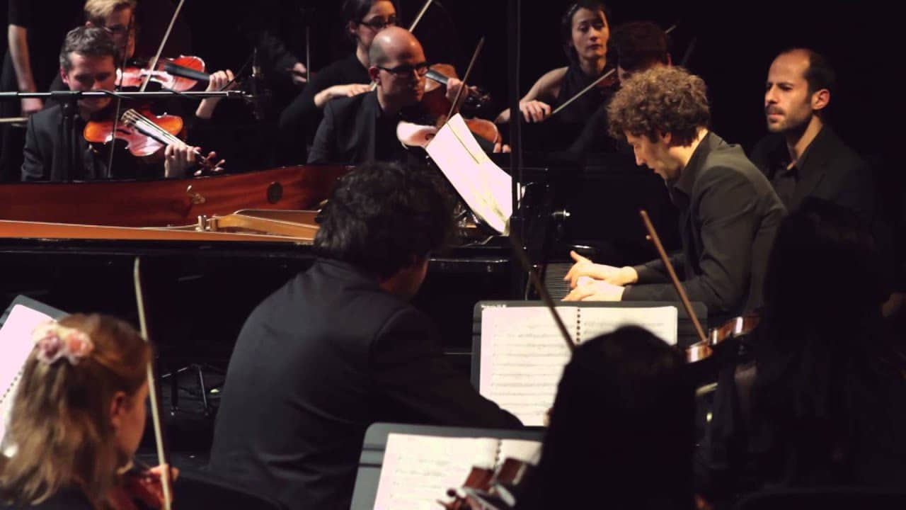 Orchestra plays Beethoven 7 as all around them falls apart