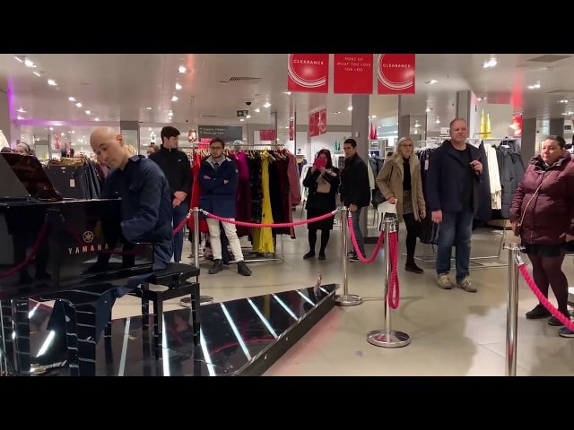 A store cleaner comes out as a classical pianist