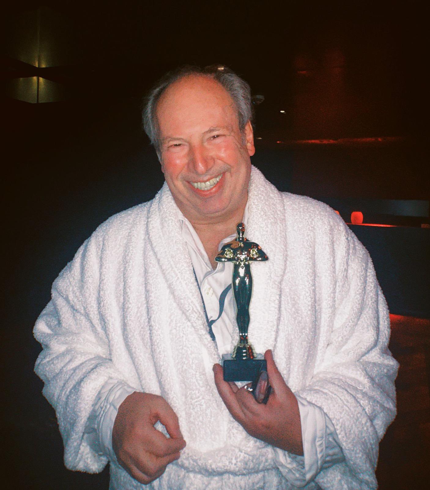 Composer receives his Oscar in a bathrobe