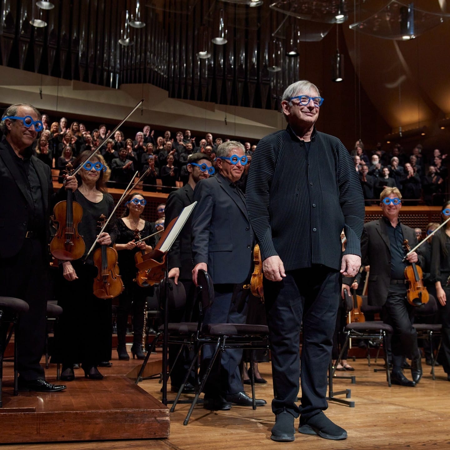 The orchestra wore blue glasses