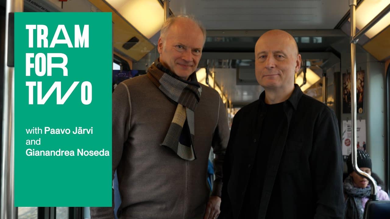 Two conductors take the tram