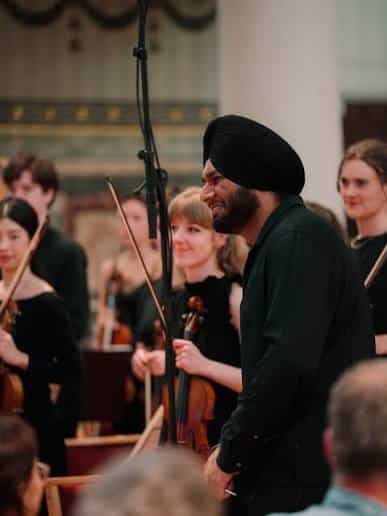 A Sikh conducts at Holland Park